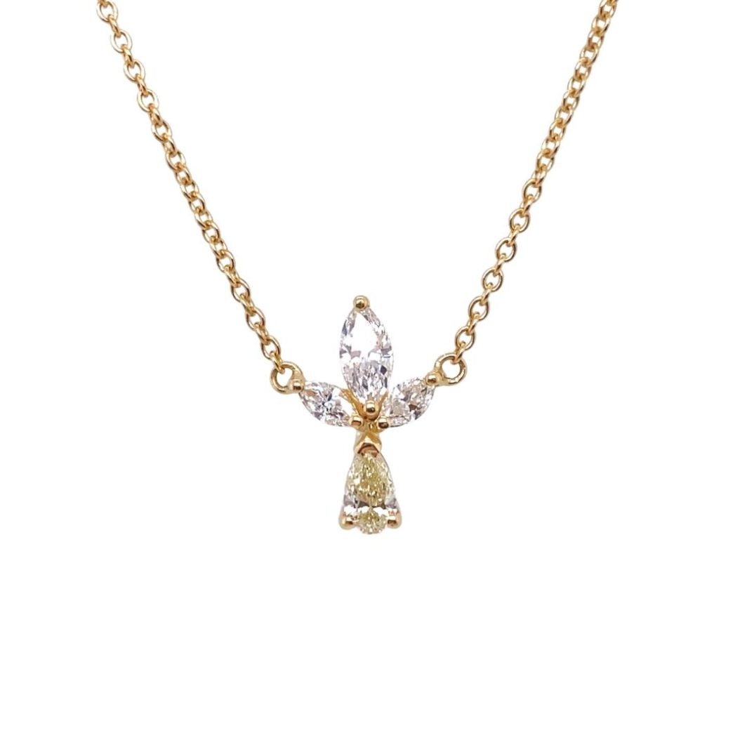a gold necklace with an angel pendant