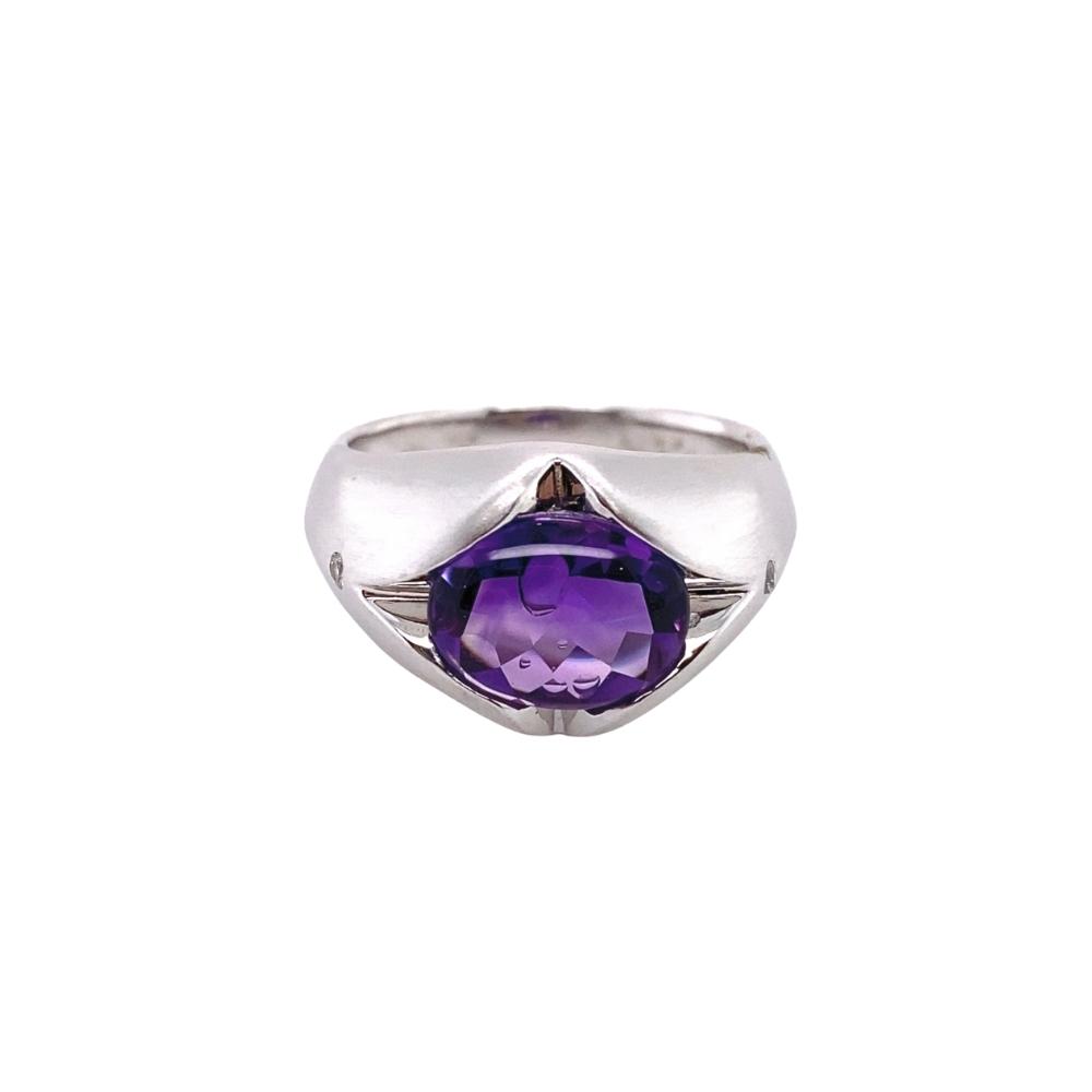 a ring with a purple stone in the center