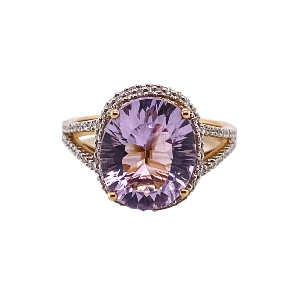 a ring with a large purple stone in the center