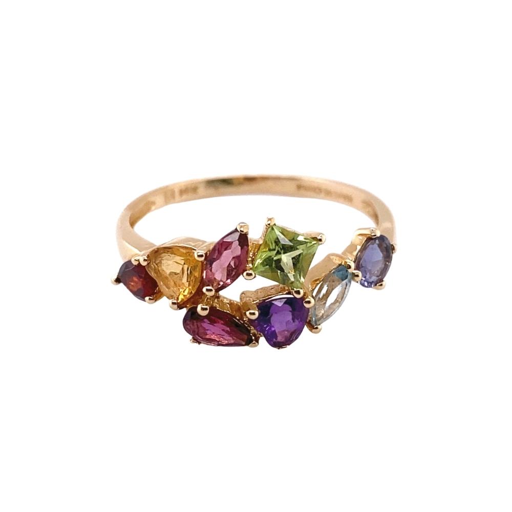 a gold ring with five different colored stones