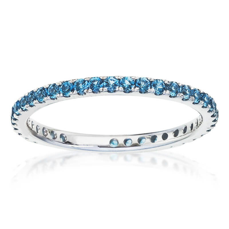 a white gold ring with blue stones