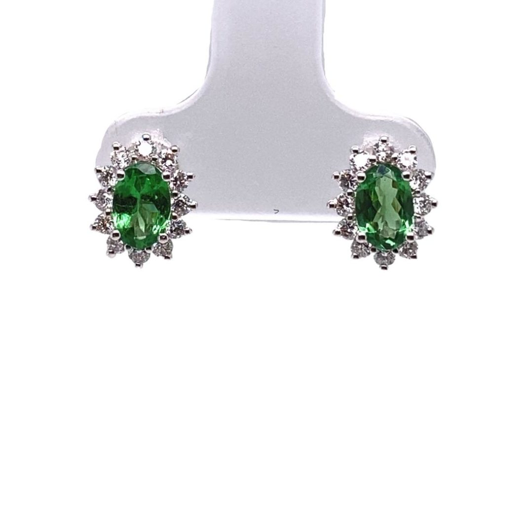 a pair of green and white earrings