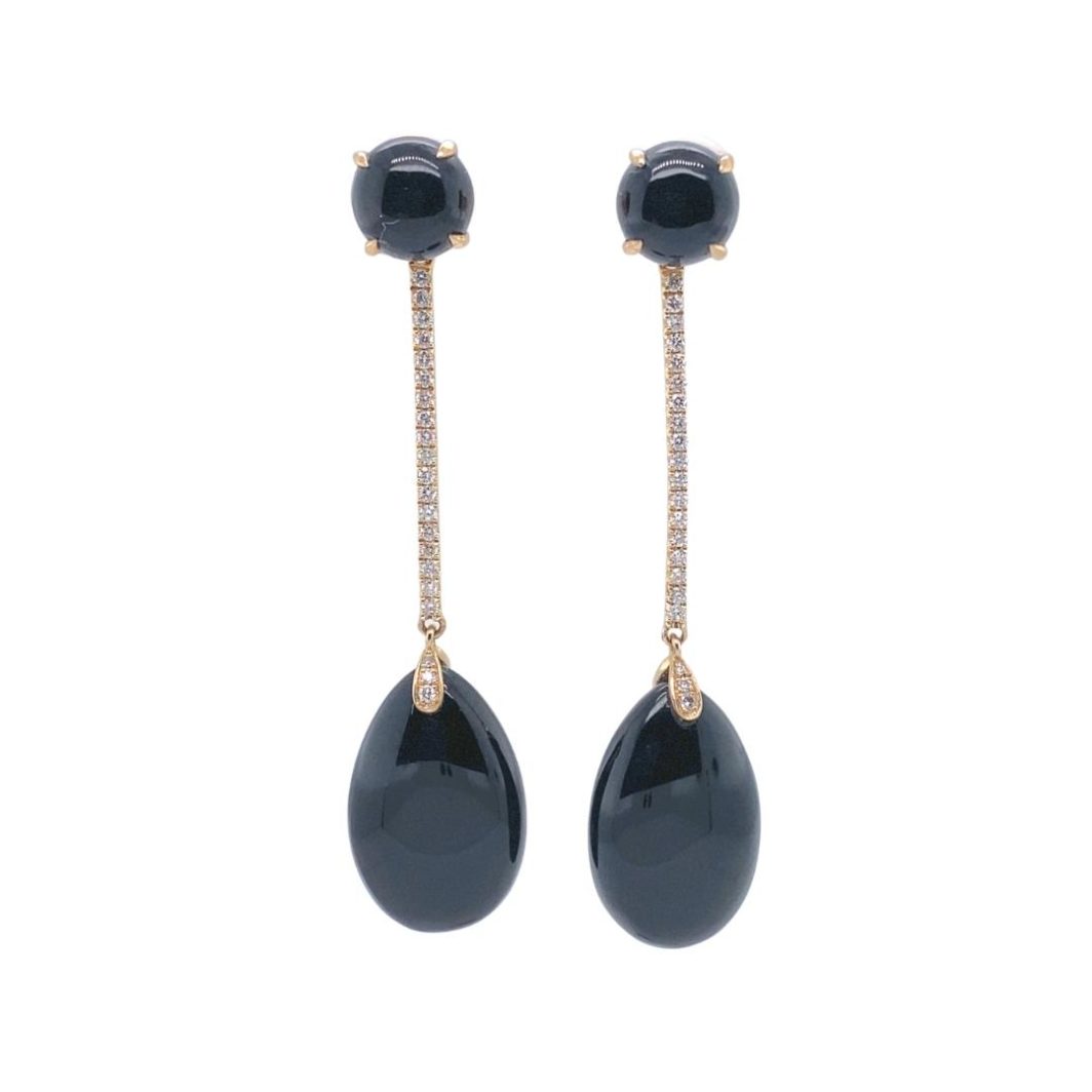 a pair of earrings with black stones and diamonds