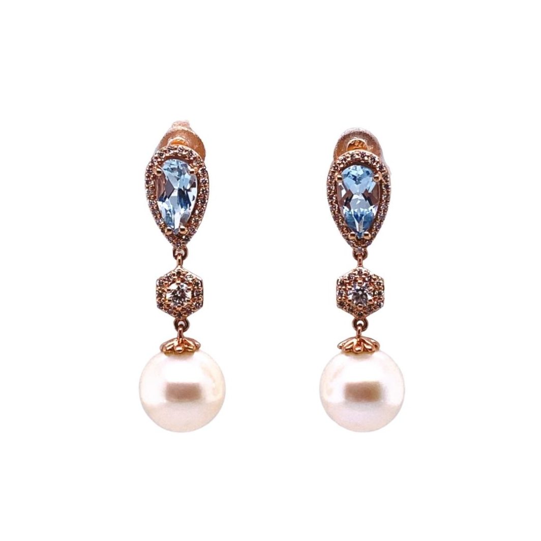 a pair of earrings with blue and white stones