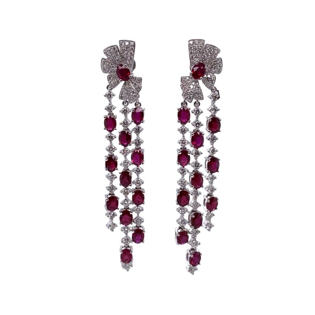 pair of earrings with red stones and white diamonds