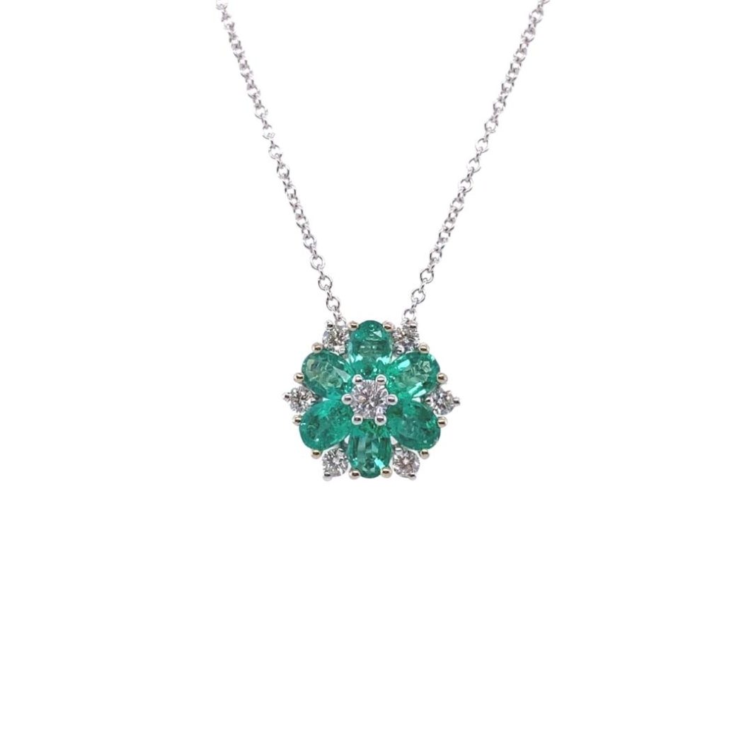 a green and white necklace with diamonds