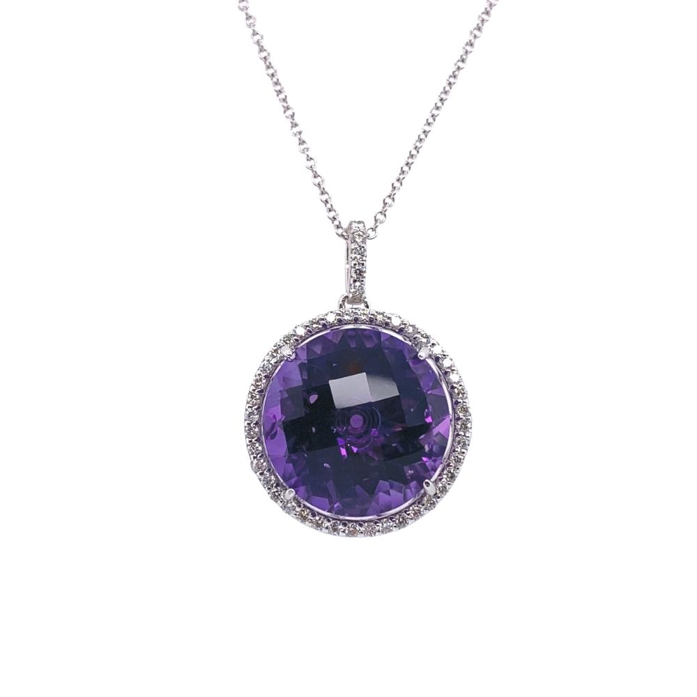 a necklace with a large purple stone in the center