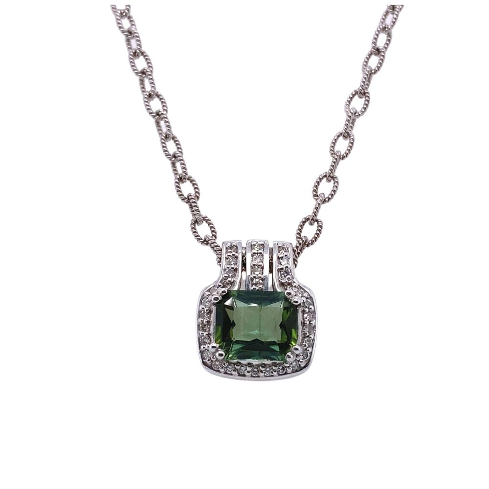a necklace with a green stone on it