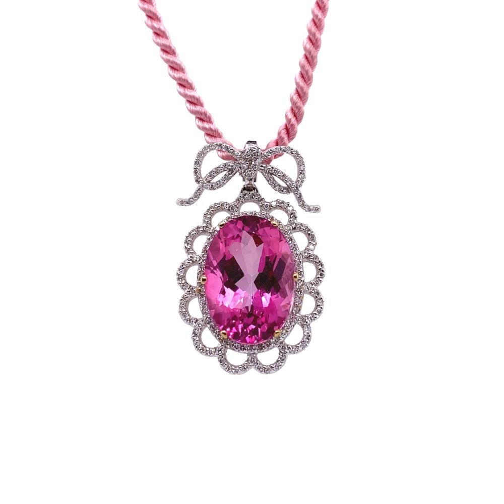 a necklace with a pink stone on it