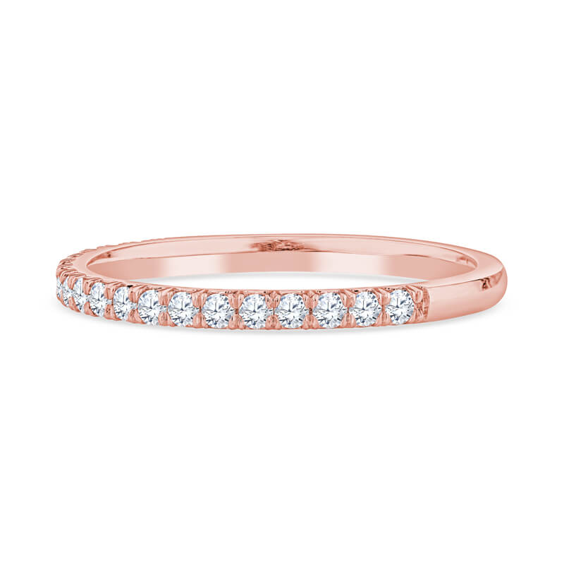 a rose gold wedding band with round diamonds