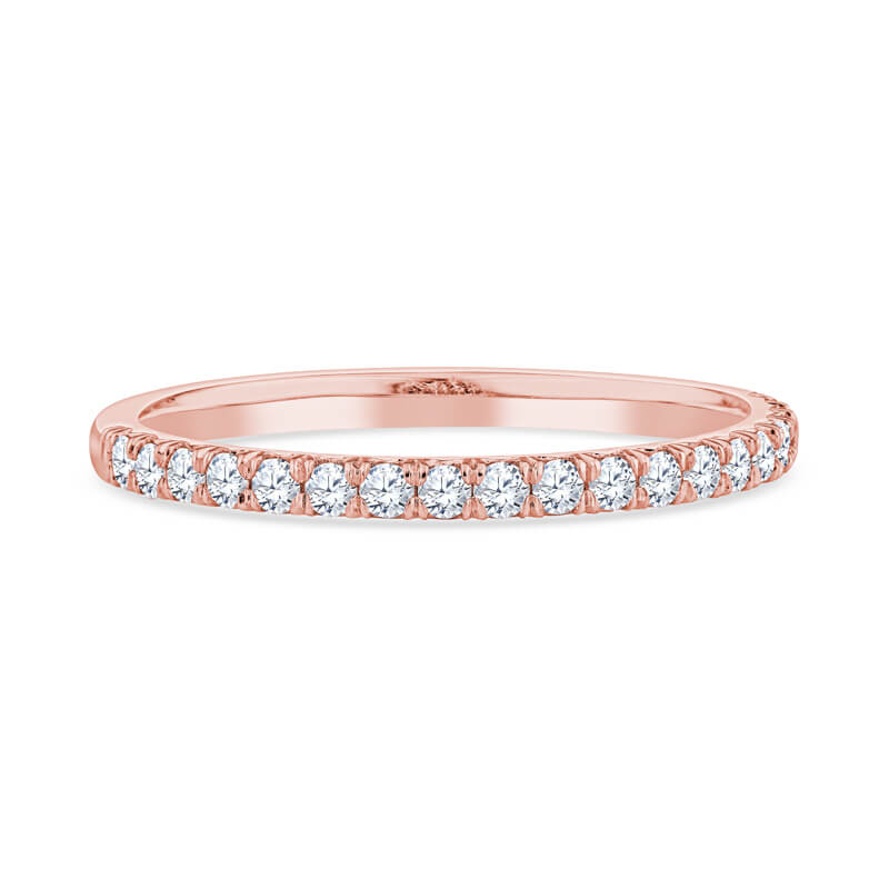 a rose gold wedding band with rows of diamonds