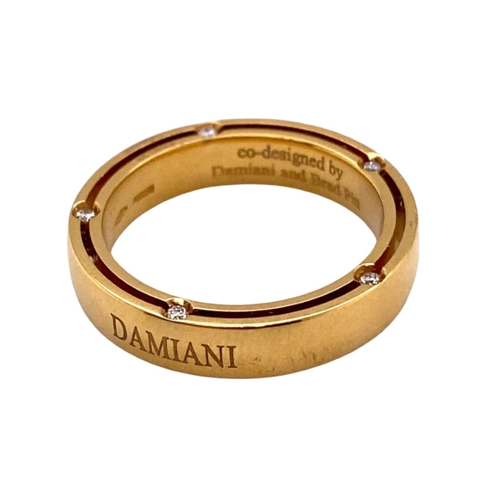 a gold ring with diamonds on it