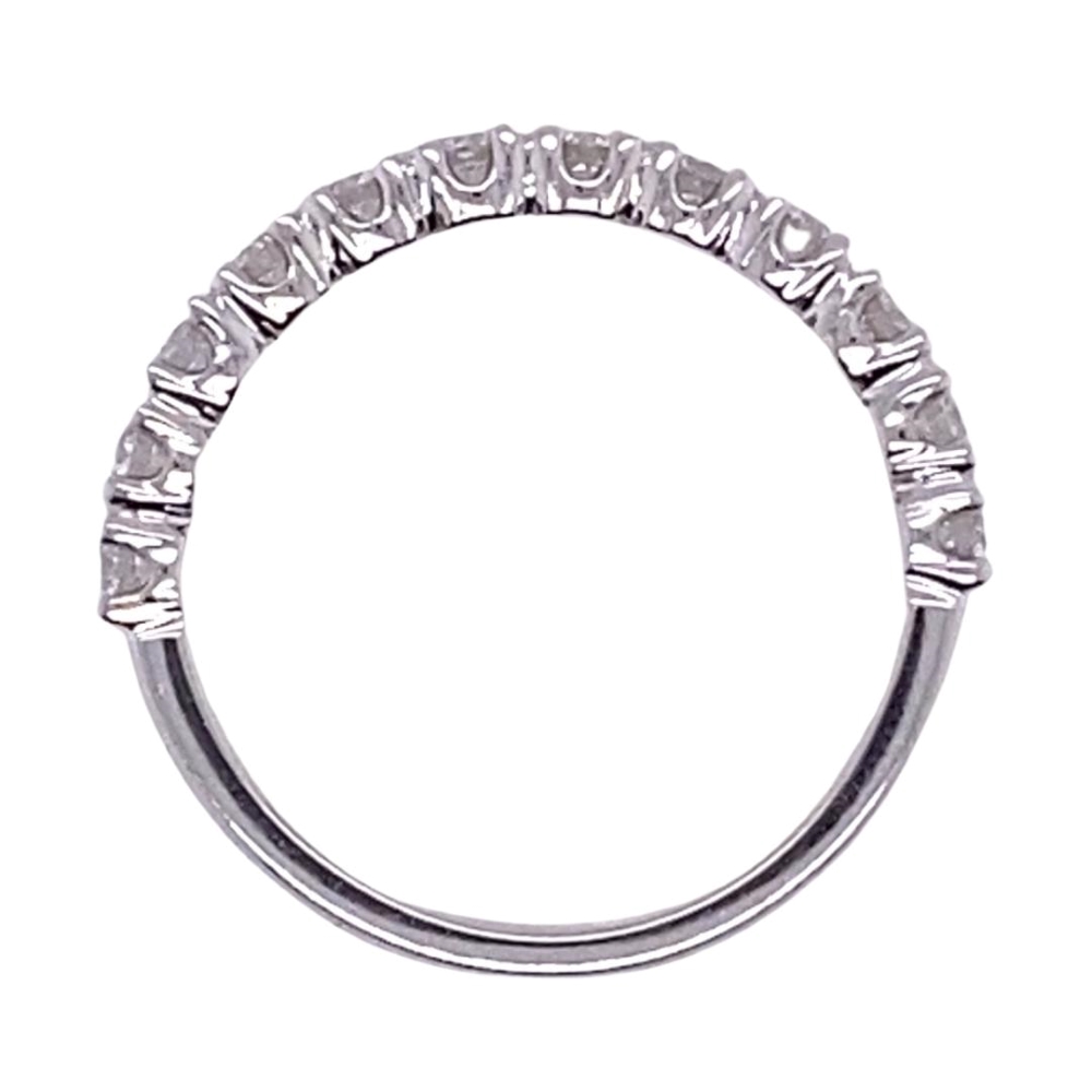 a wedding ring with five stones on it