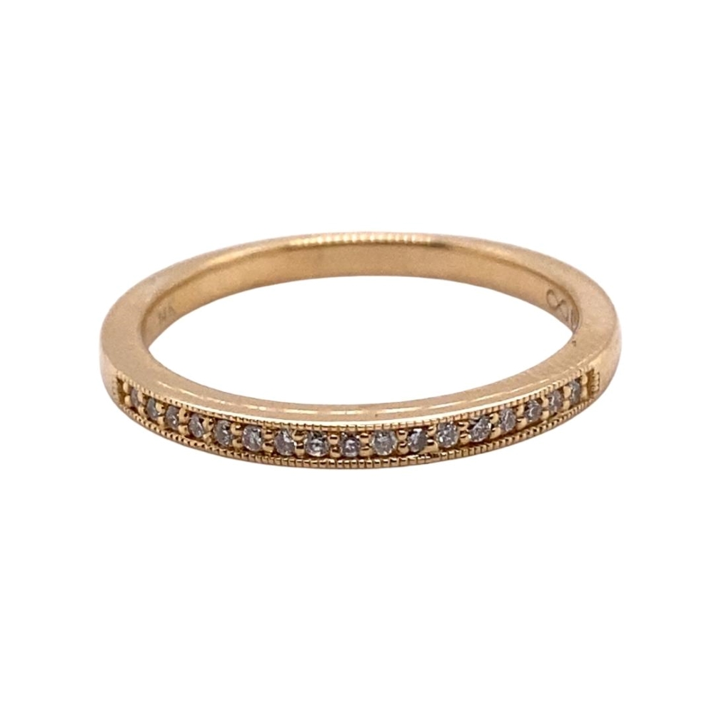 a gold ring with brown diamonds on it