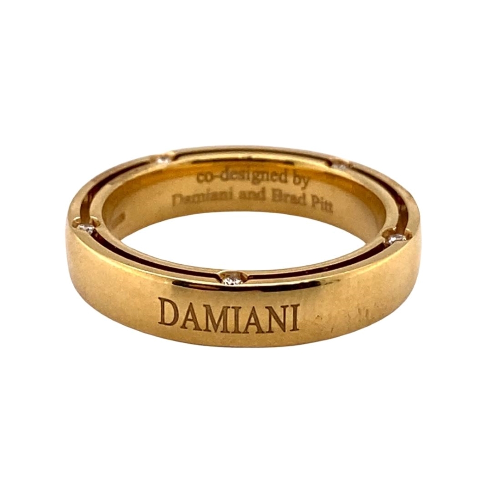a gold ring with the words damn written on it