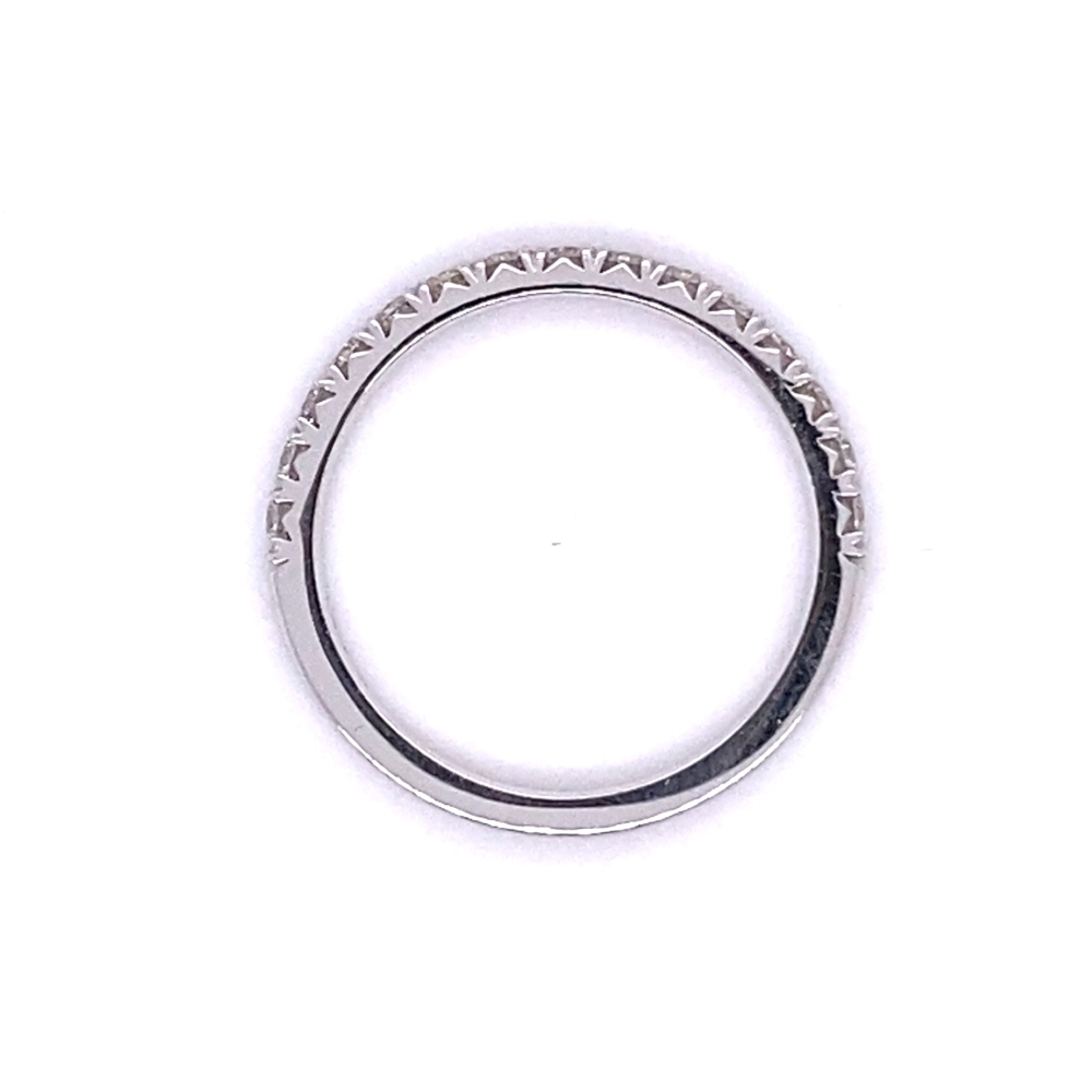 a white gold wedding ring with small diamonds