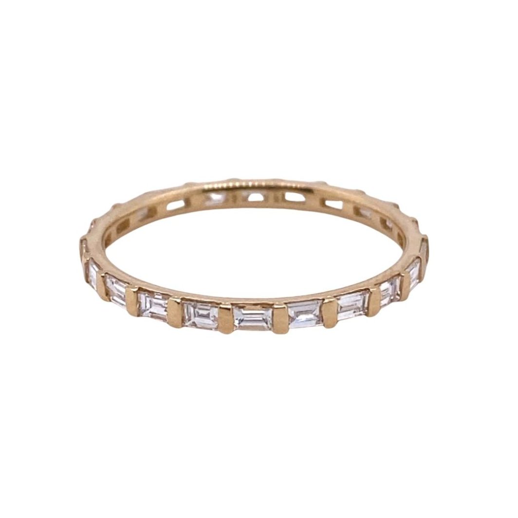 a gold band with baguettes and white stones