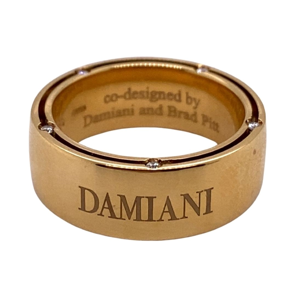 a gold ring with the word damn written on it