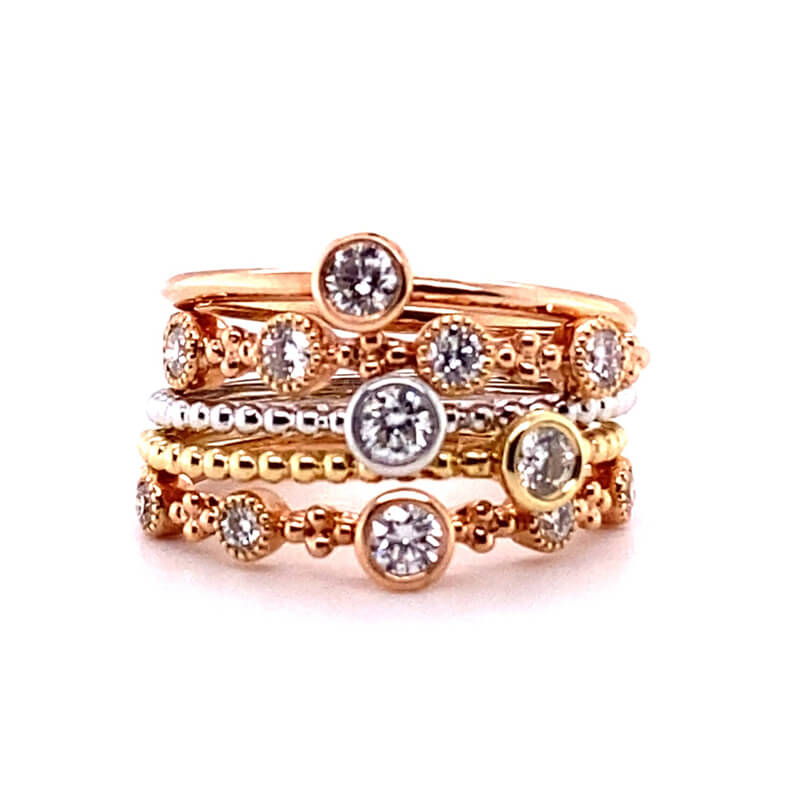 three stacking rings with diamonds on them