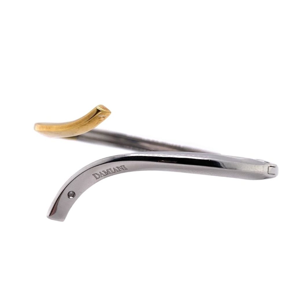 a pair of scissors with a banana on top of it