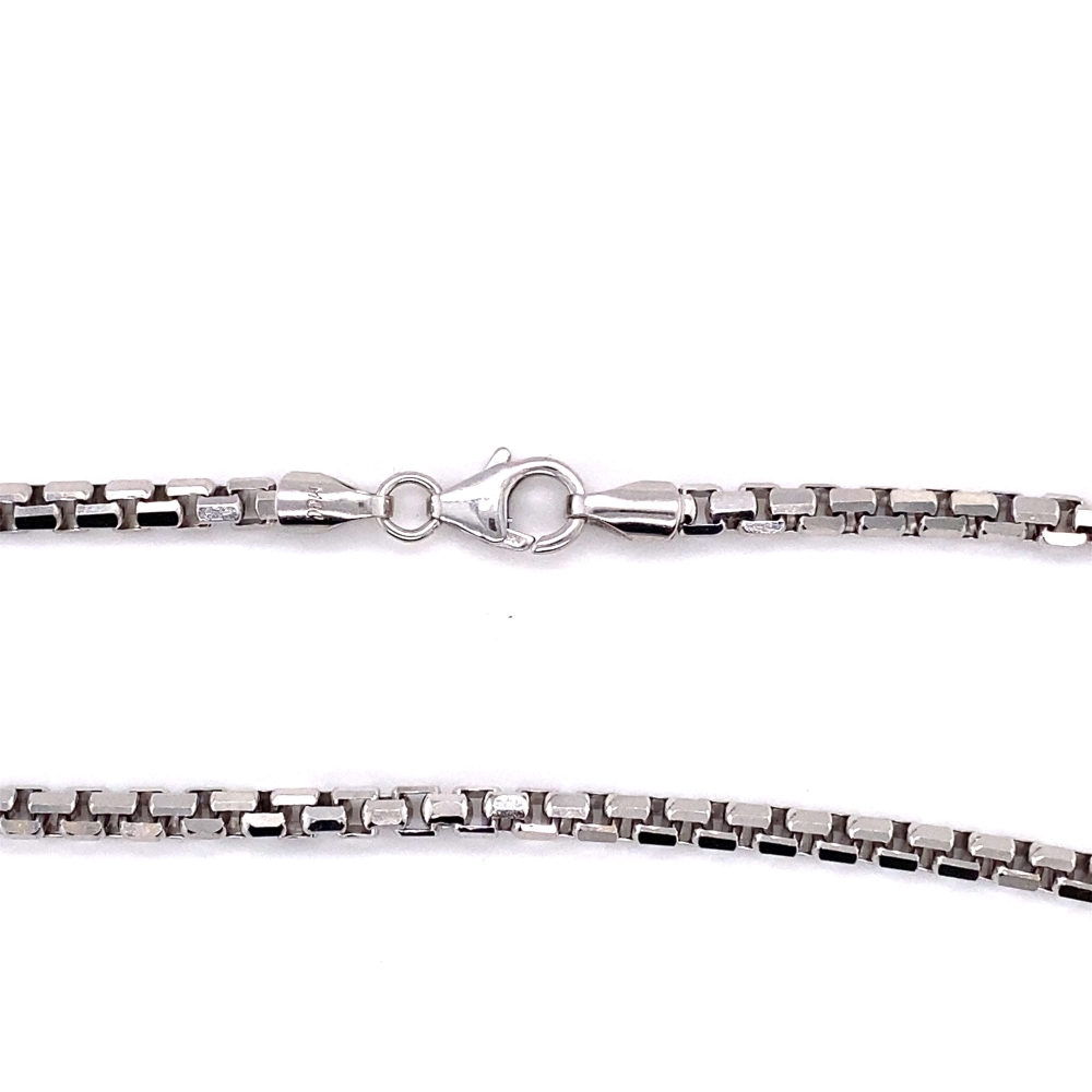 a silver chain is shown on a white background