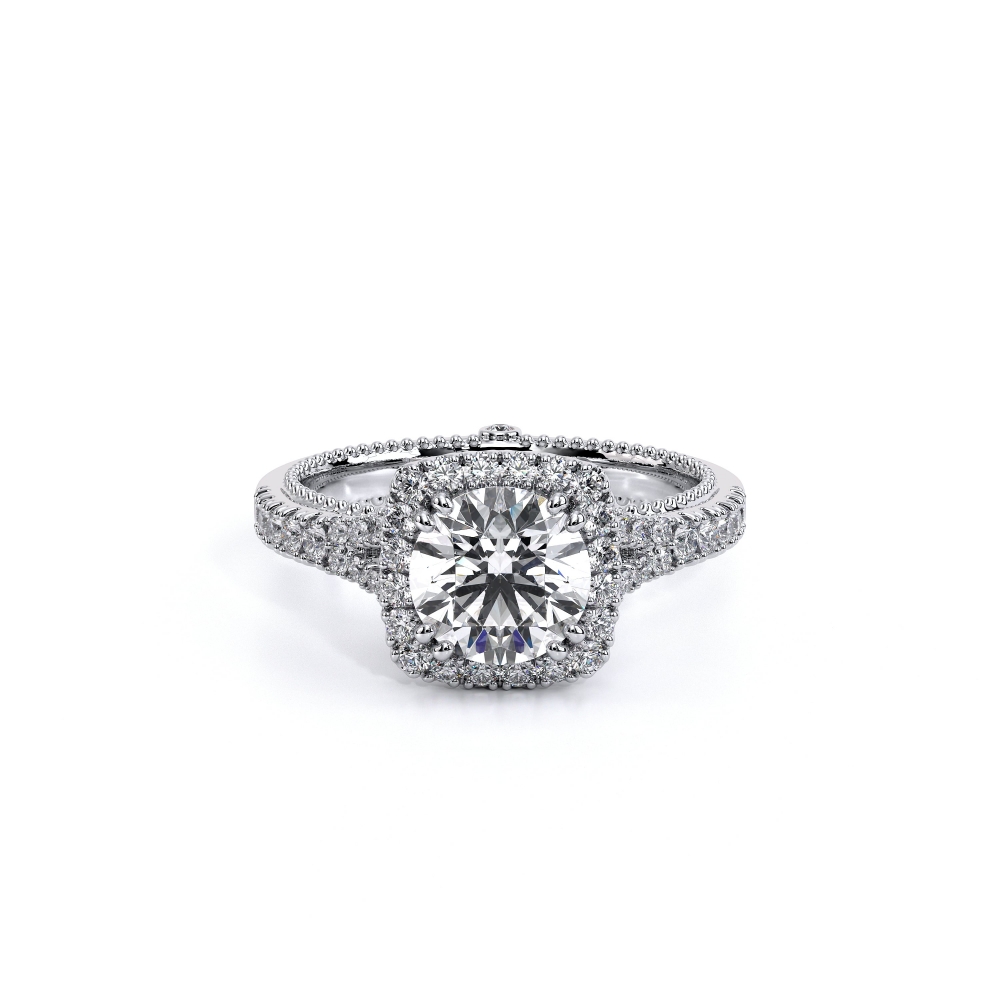 a round cut diamond ring with halos on the sides