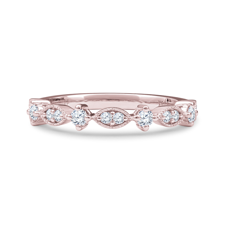 a rose gold wedding band with five diamonds