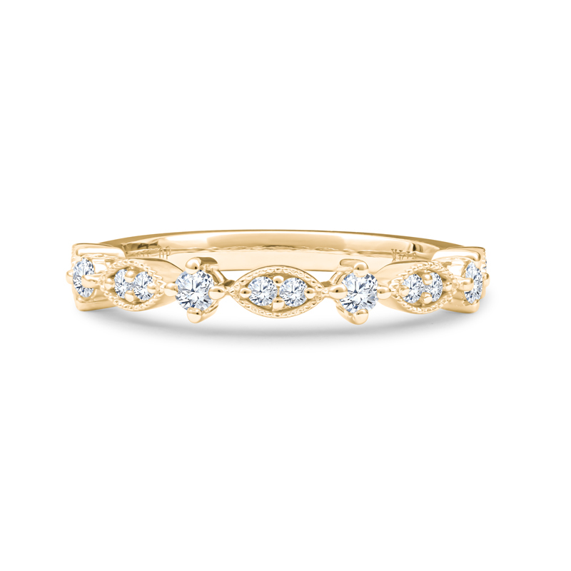 a yellow gold wedding band with five diamonds