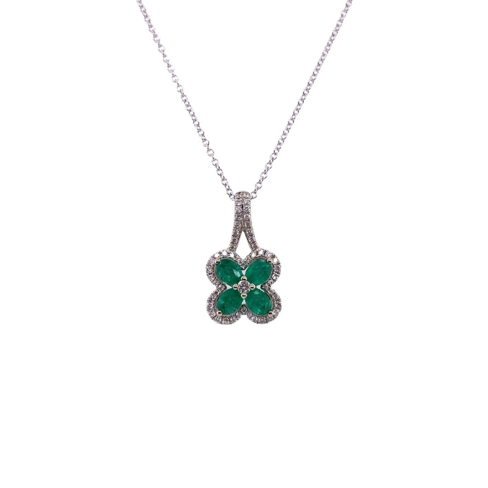 a clover shaped necklace with green stones