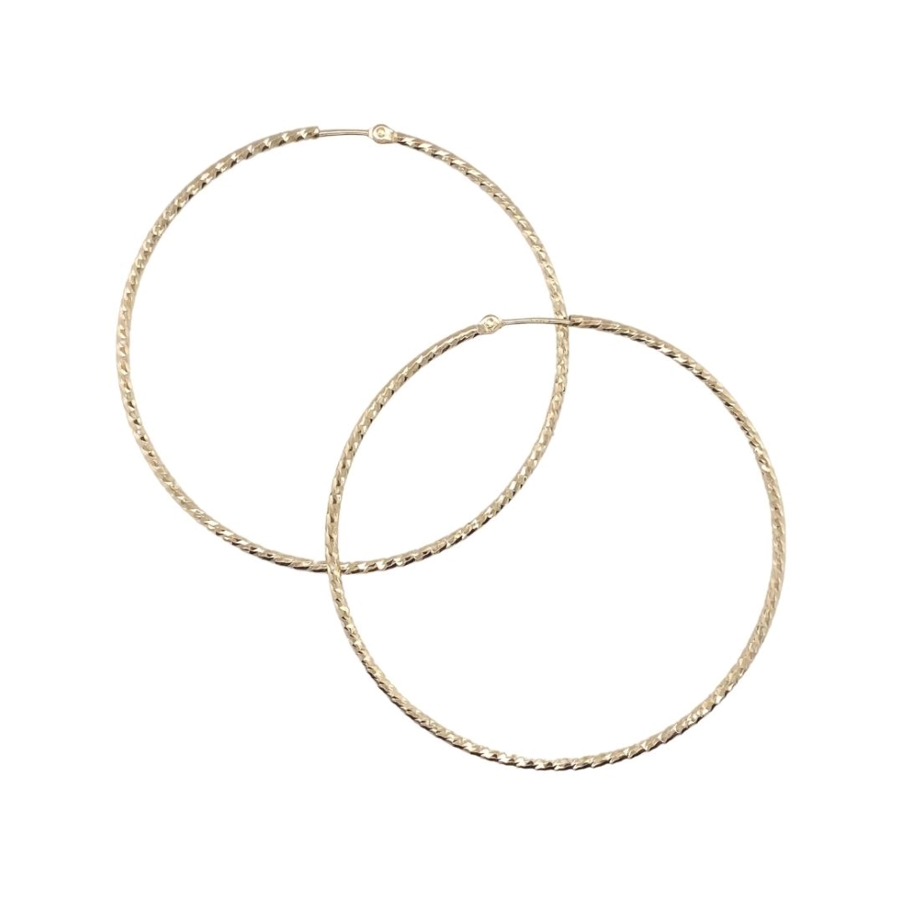 two large gold hoop earrings on a white background