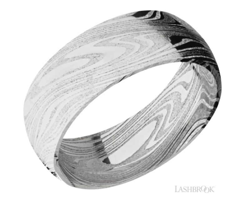 a wedding ring with black and white wood inlay