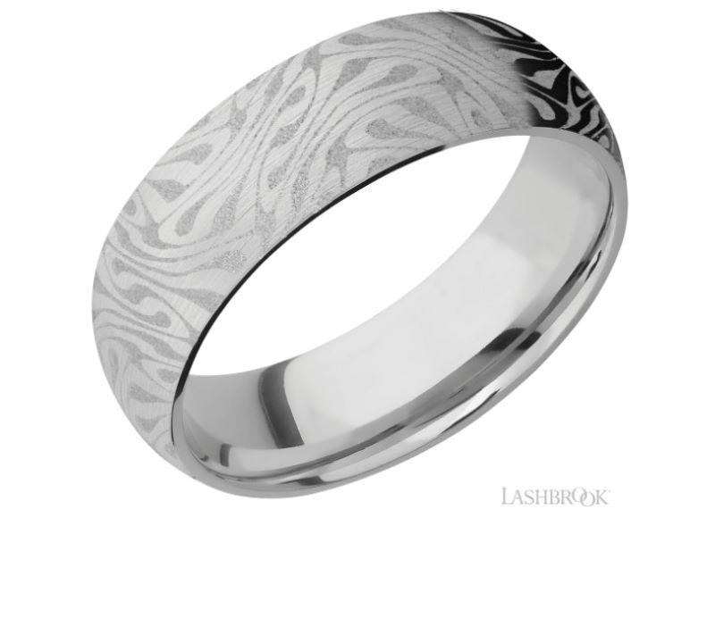 a wedding band with an intricate design in white gold