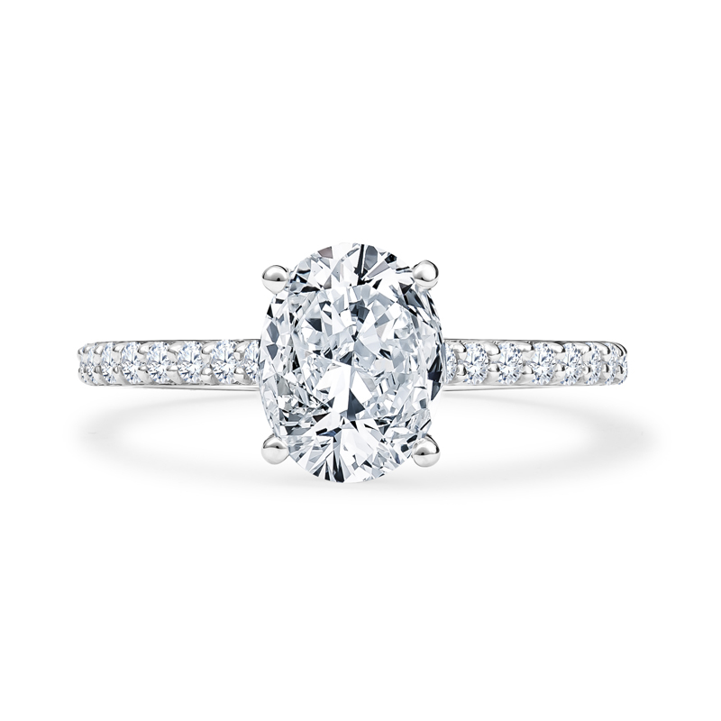 an oval cut diamond ring with pave set shoulders