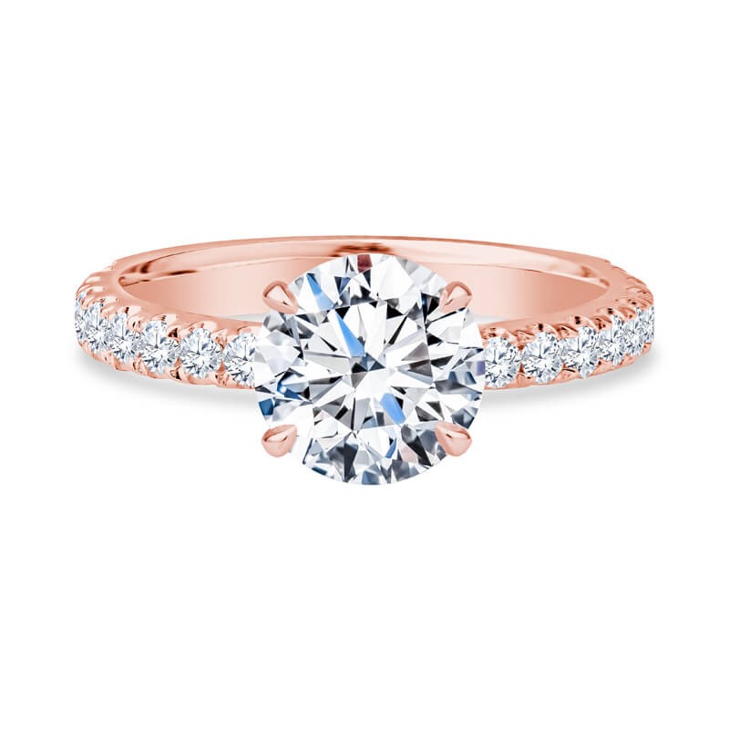 a rose gold engagement ring with a round diamond