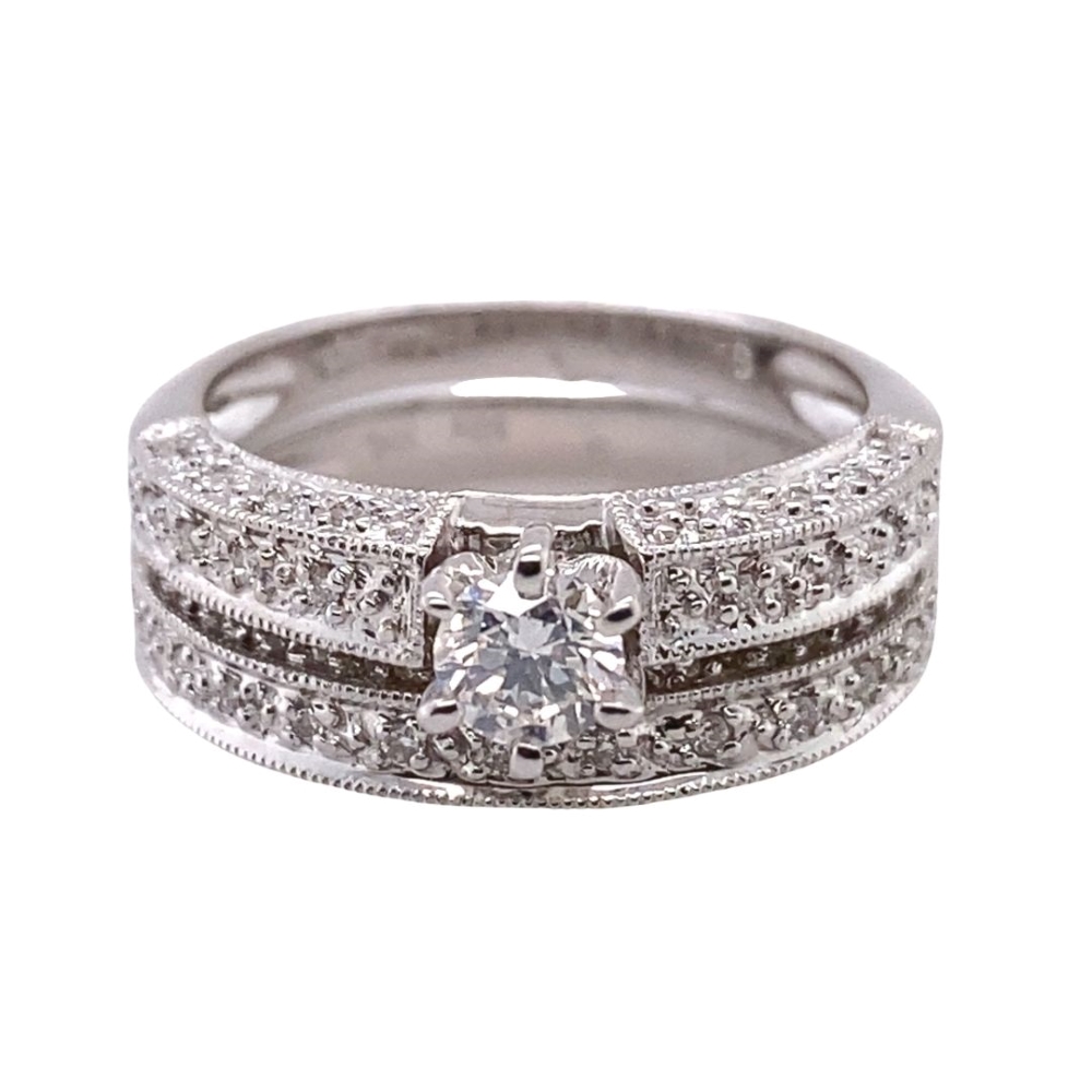 a white gold ring set with a diamond center