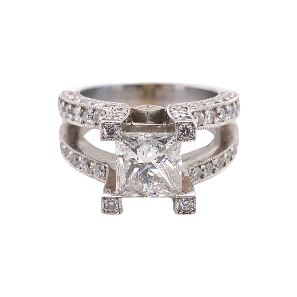 a princess cut diamond ring with pave set shoulders
