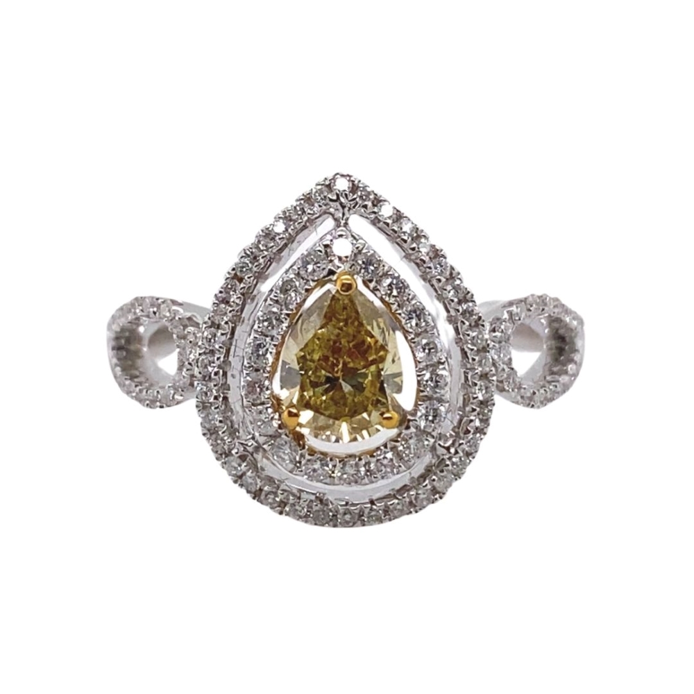 a fancy ring with a pear shaped yellow diamond