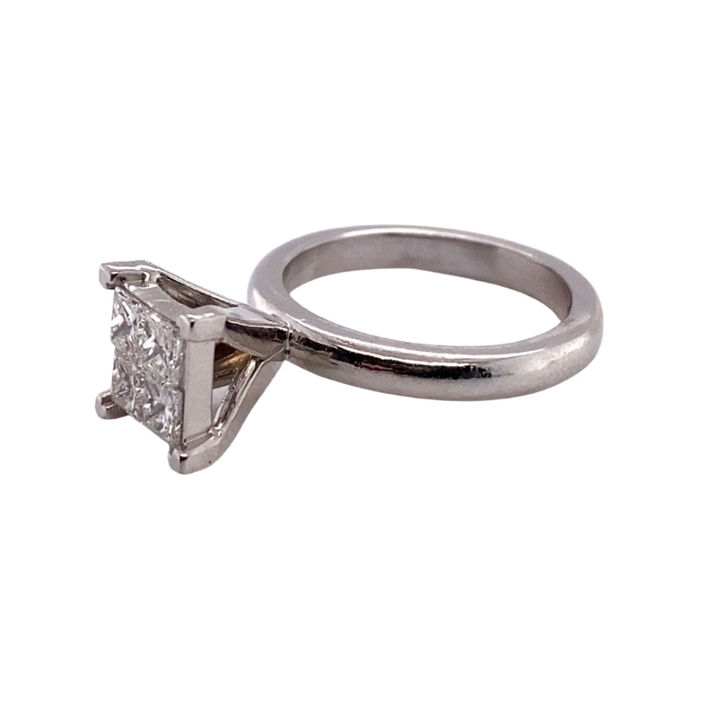 a white gold ring with a princess cut diamond