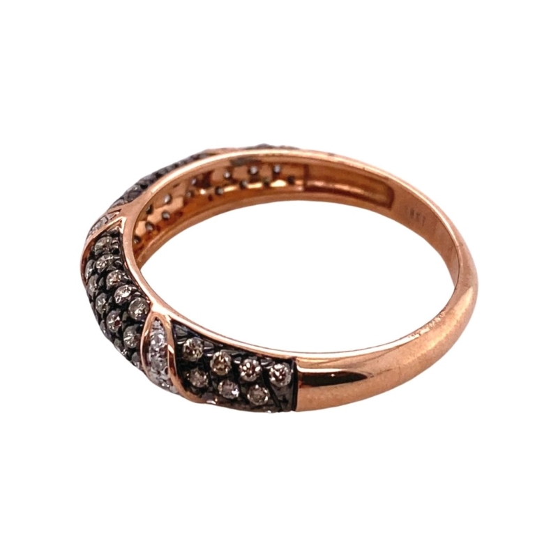 a rose gold ring with black and white diamonds