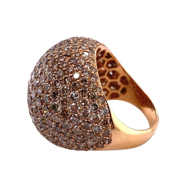 a gold ring with brown and white diamonds