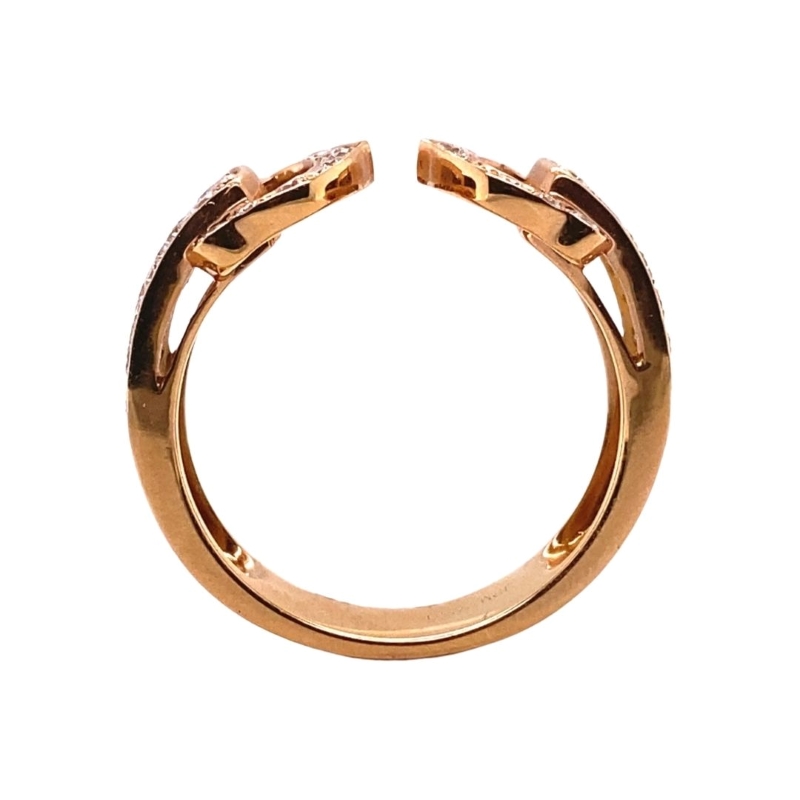 a gold ring with two diamonds on it