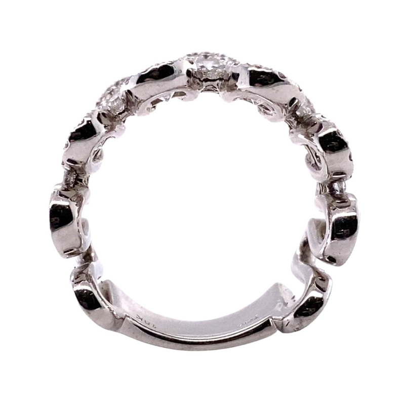 a white gold ring with black and white diamonds