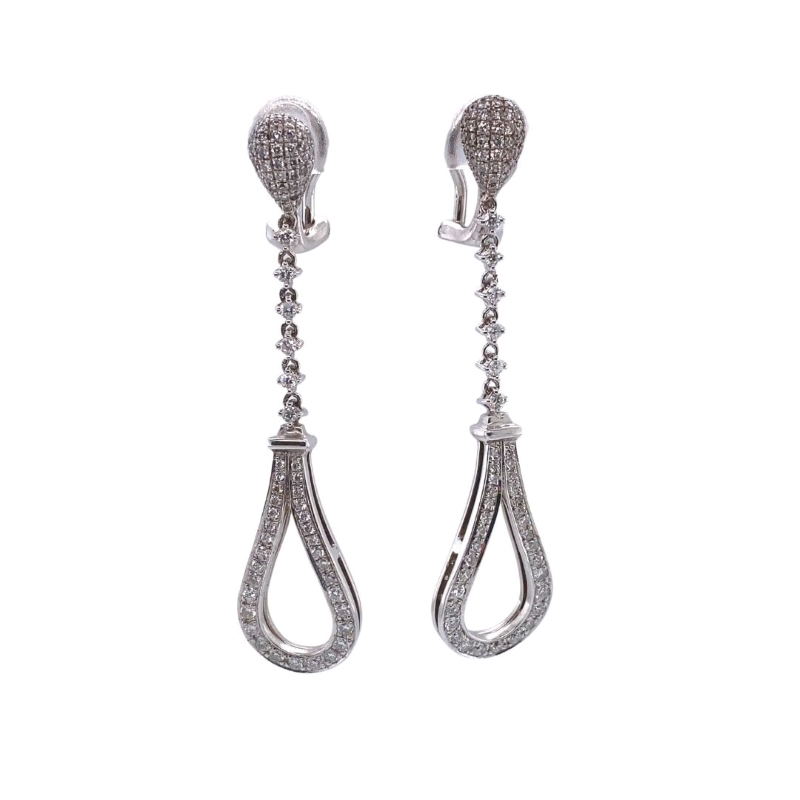 a pair of diamond earrings on a white background