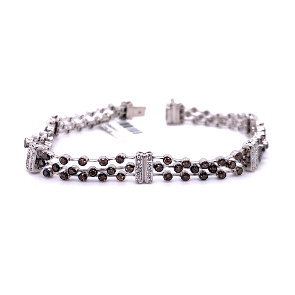 a silver bracelet with brown and white beads