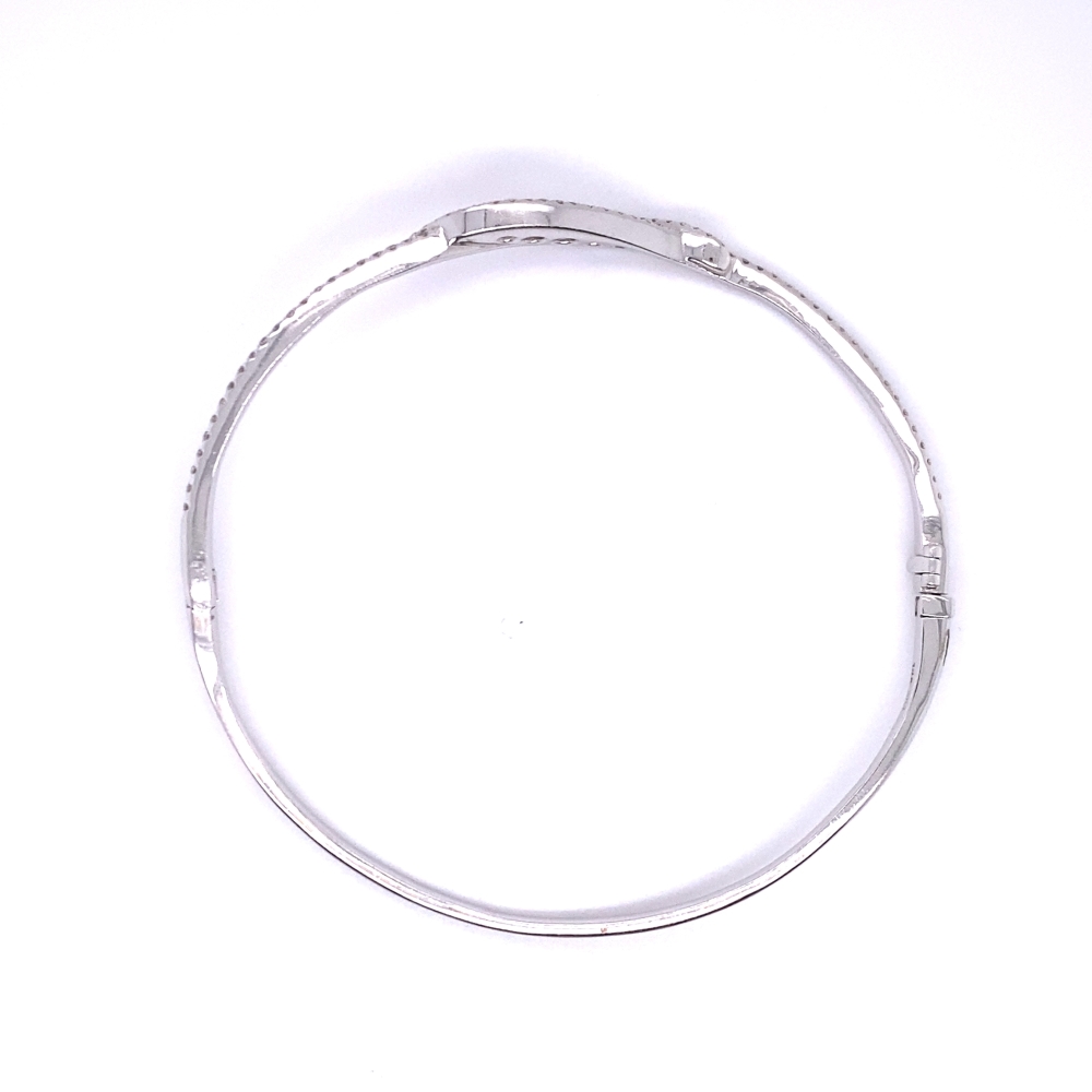 a thin silver bracelet on a white background