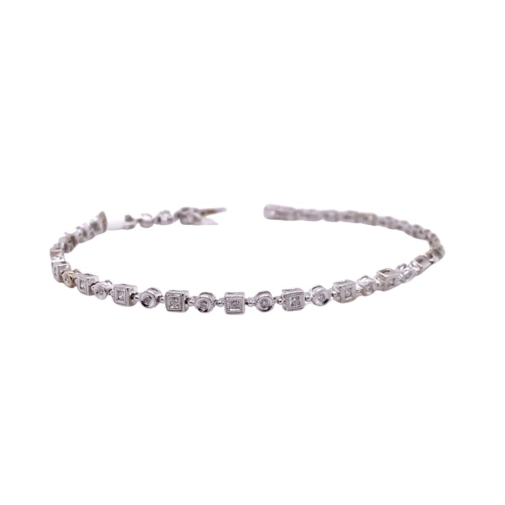 a silver bracelet with small stones on it
