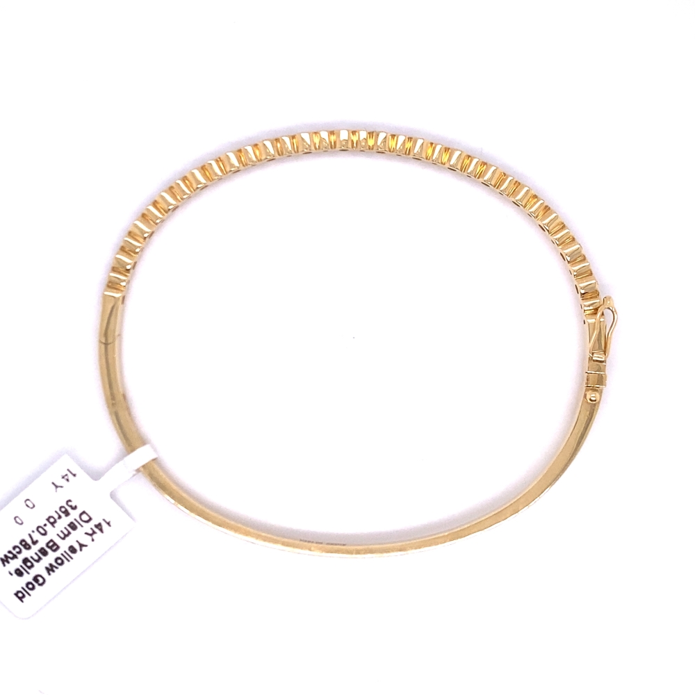 a gold bracelet with a tag on it