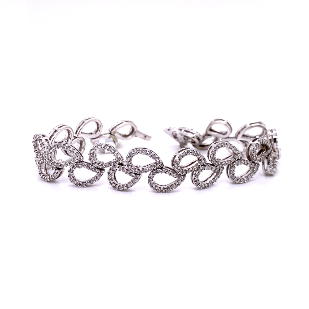 a pair of bracelets with diamonds on them