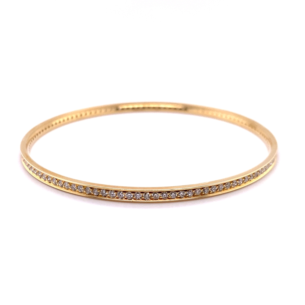 a gold bang bracelet with diamonds on it