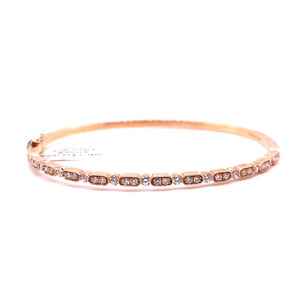 a gold bracelet with diamonds on it